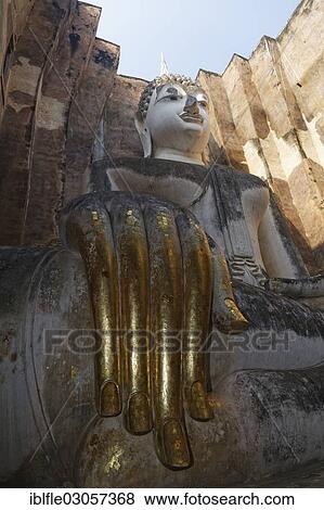 Stock Photo - "Gold-plated hand of the Seated Buddha statue of Phra Achana in Wat Si Chum Temple, Mueang Kao, Sukhothai Provinz, Northern Thailand, Thailand, Asia". Fotosearch