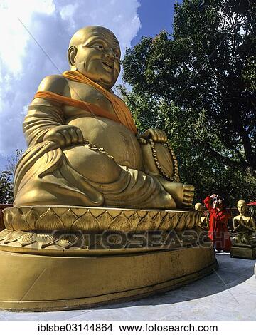 Picture - "Golden Buddha statue, Happy Buddha, mountain temple of Wat Phra That Doi Tung, Chiang Rai, Chiang Rai Province, Northern Thailand, Thailand, Asia". Fotosearch