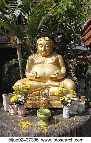 "Golden Buddha statue in the garden of the Wat Phra Singha temple, Chiang Rai, Thailand, Asia" View Large Photo Image Stock Photograph - "Golden Buddha statue in the garden of the Wat Phra Singha temple, Chiang Rai, Thailand, Asia". Fotosearch