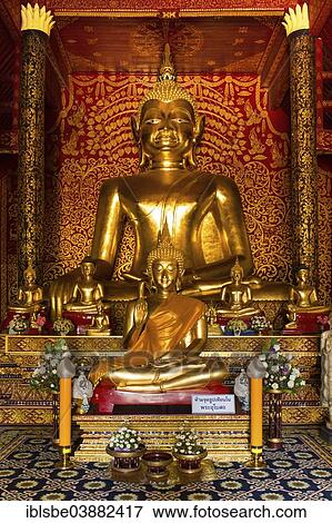 Stock Photo - "Golden Buddha statues in the Viharn of Wat Doi Ngam Muang, Chiang Rai, Chiang Rai province, Northern Thailand, Thailand, Asia". Fotosearch