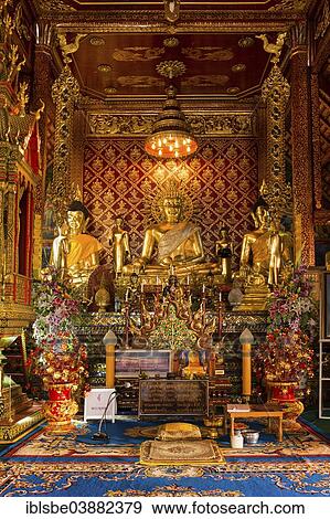 Stock Photo - "Golden Buddha statues in Wat Phrah Singh Temple, Chiang Rai, Chiang Rai province, Northern Thailand, Thailand, Asia". Fotosearch
