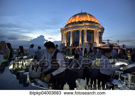 "Golden dome of the Sirocco Hotel with bartenders and guests at the bar, Bangkok, Thailand, Asia" View Large Photo Image Stock Image - "Golden dome of the Sirocco Hotel with bartenders and guests at the bar, Bangkok, Thailand, Asia". Fotosearch