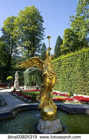 "Golden fountain figure of the goddess Fama, West Parterre, Schlosspark palace gardens, Schloss Linderhof Palace, Upper Bavaria, Bavaria, Germany, Europe" View Large Photo Image Stock Photo - "Golden fountain figure of the goddess Fama, West Parterre, Schlosspark palace gardens, Schloss Linderhof Palace, Upper Bavaria, Bavaria, Germany, Europe". Fotosearch