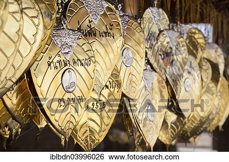 Stock Photograph - "Golden good luck leaves with messages, Chiang Mai, Thailand, Asia". Fotosearch