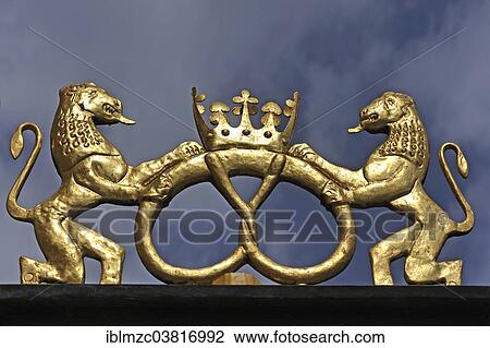 "Golden lion sculptures with pretzel, guild sign of the bakers, before rain clouds, Bayreuth, Bavaria, Germany, Europe" View Large Photo Image Stock Image - "Golden lion sculptures with pretzel, guild sign of the bakers, before rain clouds, Bayreuth, Bavaria, Germany, Europe". Fotosearch