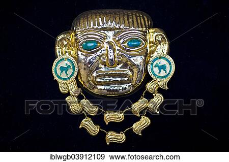 Stock Photo - "Golden pre-Columbian Inca mask, replica, sheet brass with semi-precious stones, souvenir, Cusco, Peru, South America". Fotosearch