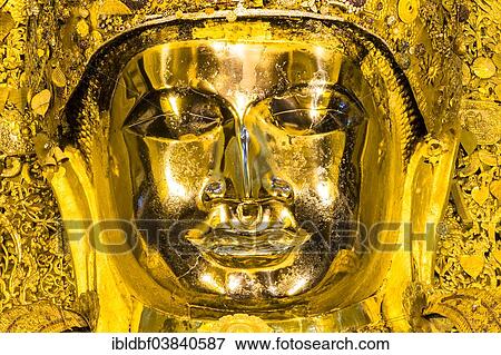 Stock Photo - "Golden seated Buddha, Mahamuni, face, Mandalay, Mandalay Division, Myanmar or Burma". Fotosearch