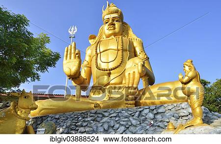 Picture - "Golden Shiva statue in Hindu Shiva temple Koneswaram, Trincomalee, Eastern Province, Sri Lanka, Asia". Fotosearch