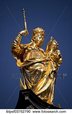 Stock Image - "Golden statue of the Virgin Mary, Mariensaeule, Marian column on Marienplatz square, Munich, Upper Bavaria, Bavaria, Germany, Europe". Fotosearch