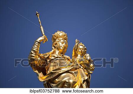 Stock Photo - "Golden statue of the Virgin Mary, Mariensaeule, Marian column on Marienplatz square, Munich, Upper Bavaria, Bavaria, Germany, Europe". Fotosearch