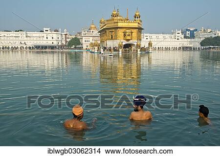 "Golden Temple, Hari Mandir, the main shrine of the Sikh, three pilgrims wearing turbans taking a ritual bath in the holy lake of Amrit Sagar, Amritsar, Amritsar, Punjab, India, Asia" View Large Photo Image Picture - "Golden Temple, Hari Mandir, the main shrine of the Sikh, three pilgrims wearing turbans taking a ritual bath in the holy lake of Amrit Sagar, Amritsar, Amritsar, Punjab, India, Asia". Fotosearch