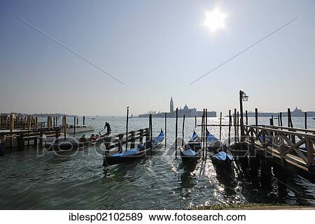 Stock Photo - "Gondolas, looking towards the island and Church of San Giorgio Maggiore, Molo della Piazzetta San Marco, St. Mark's Square, Venice, Venezia, Veneto, Italy, Europe". Fotosearch