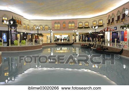 "Gondolas on a canal, luxury shopping centre, Villaggio Mall designed in a Venetian style, Aspire Zone, Doha, Doha, Qatar, Asia" View Large Photo Image Stock Photograph - "Gondolas on a canal, luxury shopping centre, Villaggio Mall designed in a Venetian style, Aspire Zone, Doha, Doha, Qatar, Asia". Fotosearch