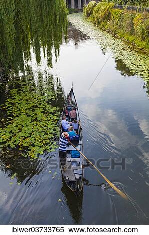 "Gondolier in a gondola on the Karl-Heine Canal, Plagwitz, Leipzig, Saxony, Germany, Europe" View Large Photo Image Stock Photography - "Gondolier in a gondola on the Karl-Heine Canal, Plagwitz, Leipzig, Saxony, Germany, Europe". Fotosearch