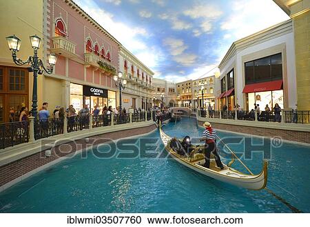 "Gondolier in a Gondola with tourists in a replica of Venetian streets under an artificial sky, Grand Canal, 5-star luxury hotel, The Venetian Casino, Las Vegas, Nevada, United States, North America" View Large Photo Image Stock Image - "Gondolier in a Gondola with tourists in a replica of Venetian streets under an artificial sky, Grand Canal, 5-star luxury hotel, The Venetian Casino, Las Vegas, Nevada, United States, North America". Fotosearch