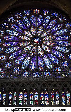 Stock Image - "Gothic Rayonnant stained glass rose window, Cathedral Basilica of Saint Denis, Basilique Saint-Denis, Paris, Ile-de-France, France, Europe". Fotosearch