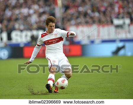 Stock Photo - "Gotoku Sakai, VfB Stuttgart, with the ball, sending over a cross, Mercedes-Benz Arena, Stuttgart, Baden-Wuerttemberg, Germany, Europe". Fotosearch