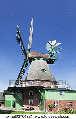 "Gott mit uns"""" Windmill, German for """"God with us"""", Dutch gallery windmill, smock windmill, with a wind rose, Eddelak, Schleswig-Holstein, Germany, Europe" View Large Photo Image Stock Image - "Gott mit uns"""" Windmill, German for """"God with us"""", Dutch gallery windmill, smock windmill, with a wind rose, Eddelak, Schleswig-Holstein, Germany, Europe". Fotosearch