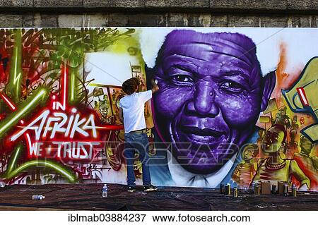 "Graffiti artists standing in front of a graffiti of Nelson Mandela, bank of the Seine River, Paris, Ile-de-France, France, Europe" View Large Photo Image Stock Photo - "Graffiti artists standing in front of a graffiti of Nelson Mandela, bank of the Seine River, Paris, Ile-de-France, France, Europe". Fotosearch
