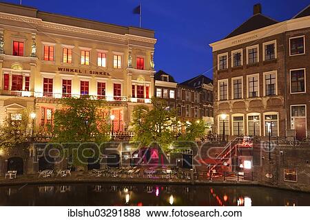 Stock Photo - "Grand cafe, restaurant and club """"Winkel van Sinkel"""" in the historic town centre at night on Oudegracht canal, Utrecht, Province of Utrecht, The Netherlands, Europe". Fotosearch