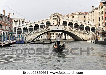 Stock Image - "Grand Canal with boats, gondolas and the Rialto Bridge, Venice, Veneto, Italy, Europe". Fotosearch
