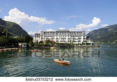 Stock Image - "Grand Hotel Zell am See, on Lake Zell, pedalos at front, Zell am See, Salzburger Land, Oberosterreich, Austria, Europe". Fotosearch