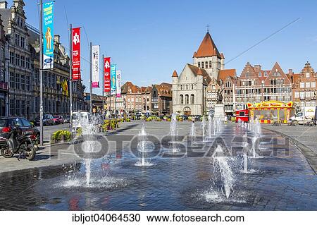 Stock Image - "Grand Place, Church of St. Quentin, water games, the Cloth Hall, Halle aux Draus, on the left, historic centre, Tournai, Hainaut, Belgium, Europe". Fotosearch