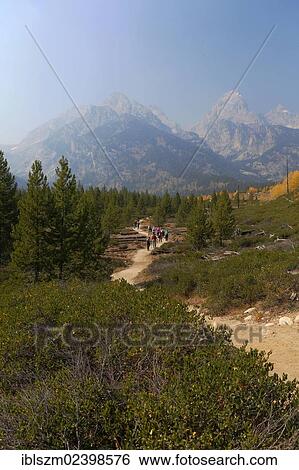 "Grand Teton mountain range from the trail to Taggart Lake, Grand Teton National Park, Wyoming, USA" View Large Photo Image Stock Photograph - "Grand Teton mountain range from the trail to Taggart Lake, Grand Teton National Park, Wyoming, USA". Fotosearch
