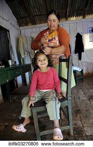 "Grandmother, 74, combing the hair of her granddaughter, 3, Pastoreo, Caaguazu Department, Paraguay, South America" View Large Photo Image Stock Photography - "Grandmother, 74, combing the hair of her granddaughter, 3, Pastoreo, Caaguazu Department, Paraguay, South America". Fotosearch