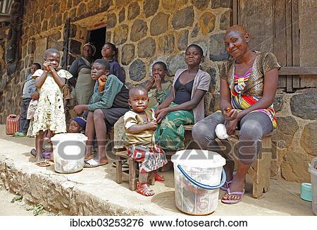 Stock Photograph - "Grandson of King Yu Vincent at the entrance to the Palace of Laikom, Laikom, Northwest Region, Cameroon, Africa". Fotosearch