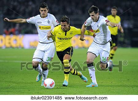 Stock Photography - "Granit Xhaka, Gladbach, Mario Goetze, Dortmund, Havard Nordtveit, Gladbach, Borussia Dortmund - Borussia Moenchengladbach 5: 0, Signal Iduna Park Dortmund, North Rhine-Westphalia, Germany, Europe". Fotosearch