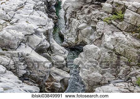 "Granite rock formations in the Maggia river in the Maggia Valley, Valle Maggia, Ponte Brolla, Canton of Ticino, Switzerland, Europe" View Large Photo Image Stock Image - "Granite rock formations in the Maggia river in the Maggia Valley, Valle Maggia, Ponte Brolla, Canton of Ticino, Switzerland, Europe". Fotosearch