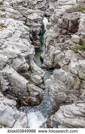 "Granite rock formations in the Maggia river in the Maggia Valley, Valle Maggia, Ponte Brolla, Canton of Ticino, Switzerland, Europe" View Large Photo Image Stock Photo - "Granite rock formations in the Maggia river in the Maggia Valley, Valle Maggia, Ponte Brolla, Canton of Ticino, Switzerland, Europe". Fotosearch
