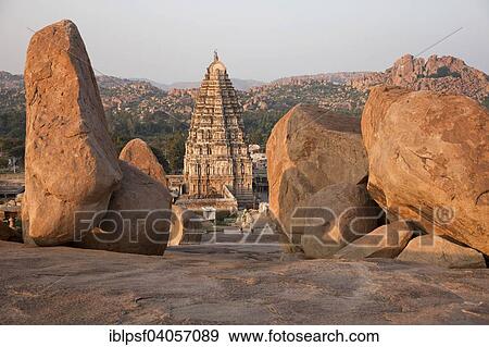Stock Photo - "Granite rocks and Gopuram of the Virupaksha Temple, Hampi, Karnataka, India, Asia". Fotosearch