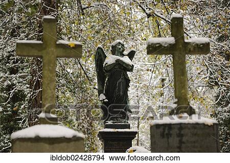 "Grave crosses and a statue of an angel, snow, Alter Suedlicher Friedhof cemetery, Munich, Bavaria, Germany, Europe" View Large Photo Image Picture - "Grave crosses and a statue of an angel, snow, Alter Suedlicher Friedhof cemetery, Munich, Bavaria, Germany, Europe". Fotosearch