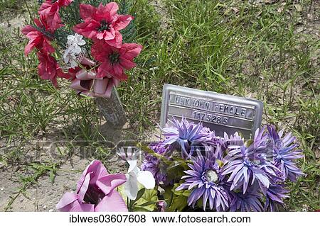 Stock Photo - "Grave on the Sacred Heart Cemetery where the remains of unidentified migrants are buried, Falfurrias, Texas, United States, North America". Fotosearch
