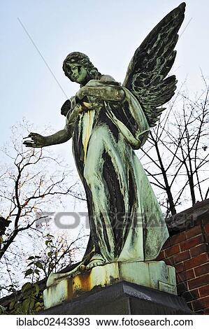 Stock Image - "Grave with an angel statue, Ostfriedhof cemetery, Munich, Bavaria, Germany, Europe". Fotosearch