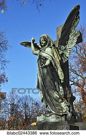 "Grave with an angel statue, Ostfriedhof cemetery, Munich, Bavaria, Germany, Europe" View Large Photo Image Stock Photograph - "Grave with an angel statue, Ostfriedhof cemetery, Munich, Bavaria, Germany, Europe". Fotosearch
