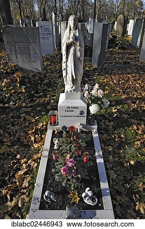 "Grave with autumn leaves on the Ostfriedhof or East Cemetery, Munich, Bavaria, Germany, Europe" View Large Photo Image Stock Image - "Grave with autumn leaves on the Ostfriedhof or East Cemetery, Munich, Bavaria, Germany, Europe". Fotosearch
