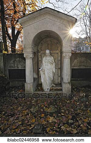 "Grave with Jesus statue and autumn leaves on the Ostfriedhof or East Cemetery, Munich, Bavaria, Germany, Europe" View Large Photo Image Stock Photo - "Grave with Jesus statue and autumn leaves on the Ostfriedhof or East Cemetery, Munich, Bavaria, Germany, Europe". Fotosearch
