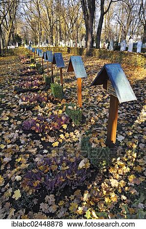 "Graves with autumn leaves, Ostfriedhof, East Cemetery, Munich, Bavaria, Germany, Europe" View Large Photo Image Stock Photo - "Graves with autumn leaves, Ostfriedhof, East Cemetery, Munich, Bavaria, Germany, Europe". Fotosearch