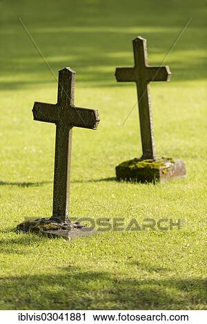 Stock Image - "Graves with Christian crosses, Vadstena, Ostergotland County, Sweden, Europe". Fotosearch