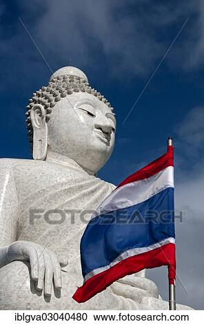 "Great Buddha made of Burmese alabaster seated in a Maravichai pose with the national flag of Thailand, Chalong, Phuket Province, Thailand, Asia" View Large Photo Image Stock Image - "Great Buddha made of Burmese alabaster seated in a Maravichai pose with the national flag of Thailand, Chalong, Phuket Province, Thailand, Asia". Fotosearch