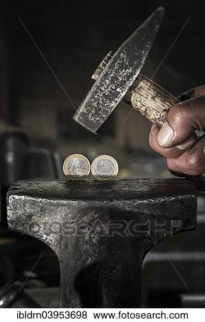 Greek euro coins under pressure in a vice and threatened by a hammer View Large Photo Image Stock Photo - Greek euro coins under pressure in a vice and threatened by a hammer. Fotosearch