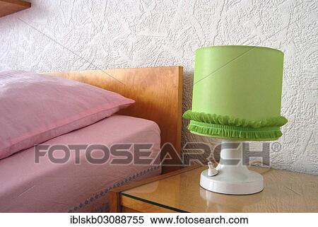 Green bedside lamp and a bed with pink sheets View Large Photo Image Stock Photography - Green bedside lamp and a bed with pink sheets. Fotosearch
