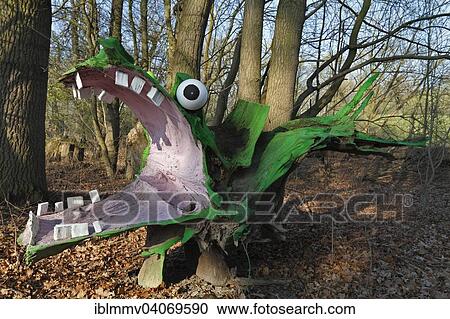 "Green Dragon sculpture made from a painted tree root, figurative art made from natural structures, Middle Elbe Biosphere Reserve, Dessau-Rosslau, Saxony-Anhalt, Germany, Europe" View Large Photo Image Stock Image - "Green Dragon sculpture made from a painted tree root, figurative art made from natural structures, Middle Elbe Biosphere Reserve, Dessau-Rosslau, Saxony-Anhalt, Germany, Europe". Fotosearch