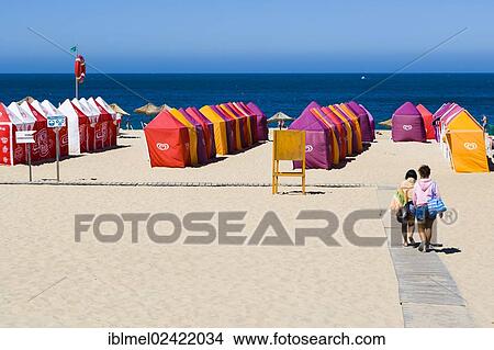 Green flag beach with beach tents, Praia da Nazare, Nazare, Oeste, Leiria District, Portugal, Europe View Large Photo Image Picture - Green flag beach with beach tents, Praia da Nazare, Nazare, Oeste, Leiria District, Portugal, Europe. Fotosearch