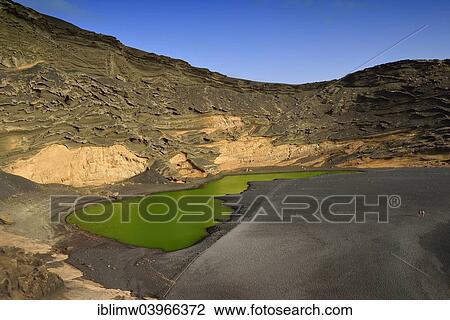 "Green lagoon, volcanic lake discolored by green algae, lava beach, Charco de los Clicos in El Golfo, Lanzarote, Canary Islands, Spain, Europe" View Large Photo Image Stock Image - "Green lagoon, volcanic lake discolored by green algae, lava beach, Charco de los Clicos in El Golfo, Lanzarote, Canary Islands, Spain, Europe". Fotosearch