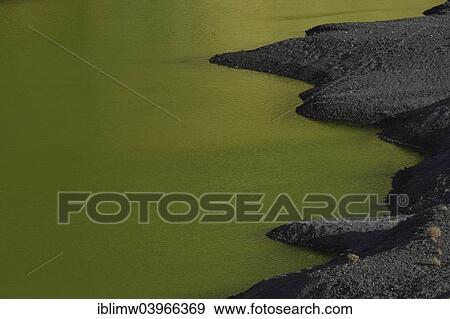 Stock Photo - "Green lagoon, volcanic lake discolored by green algae, lava beach, Charco de los Clicos in El Golfo, Lanzarote, Canary Islands, Spain, Europe". Fotosearch