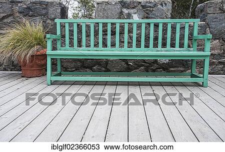 Stock Image - "Green wooden bench on a wooden terrace, County Donegal, Republic of Ireland, Europe". Fotosearch